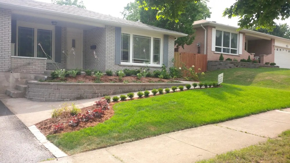 Wheelchair accessible ramp, with retaining wall and plantings